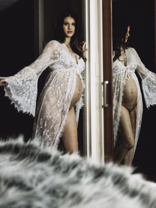 Pregnant woman in white lingerie.